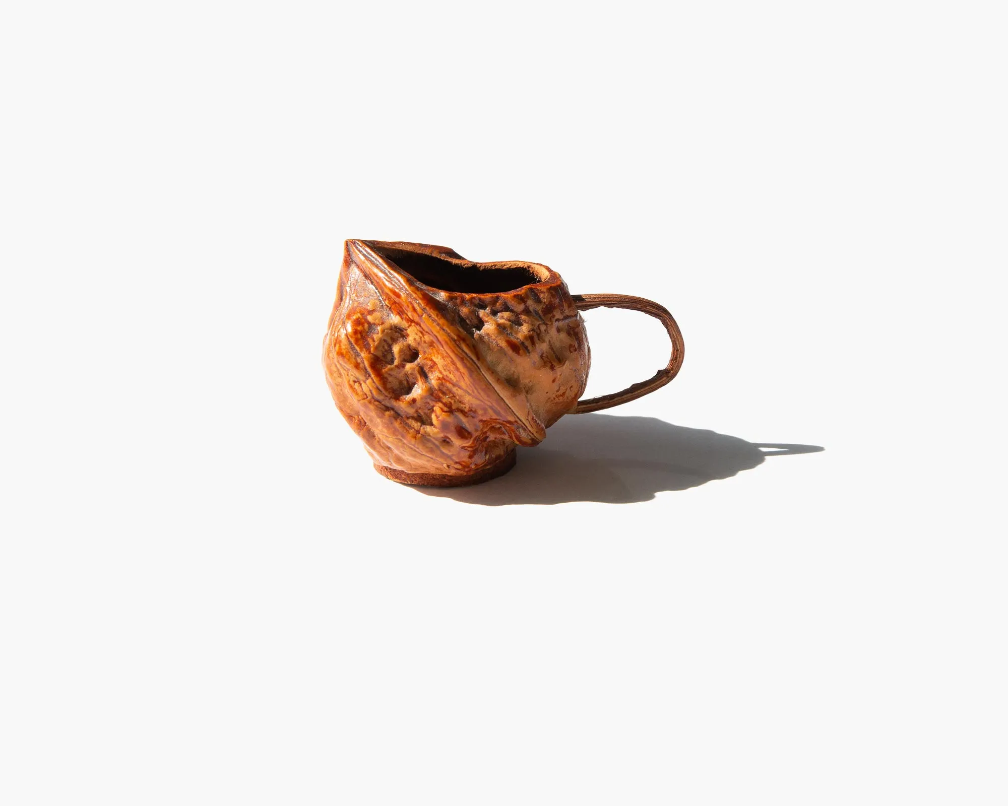 Carved Walnut Shell Pitcher