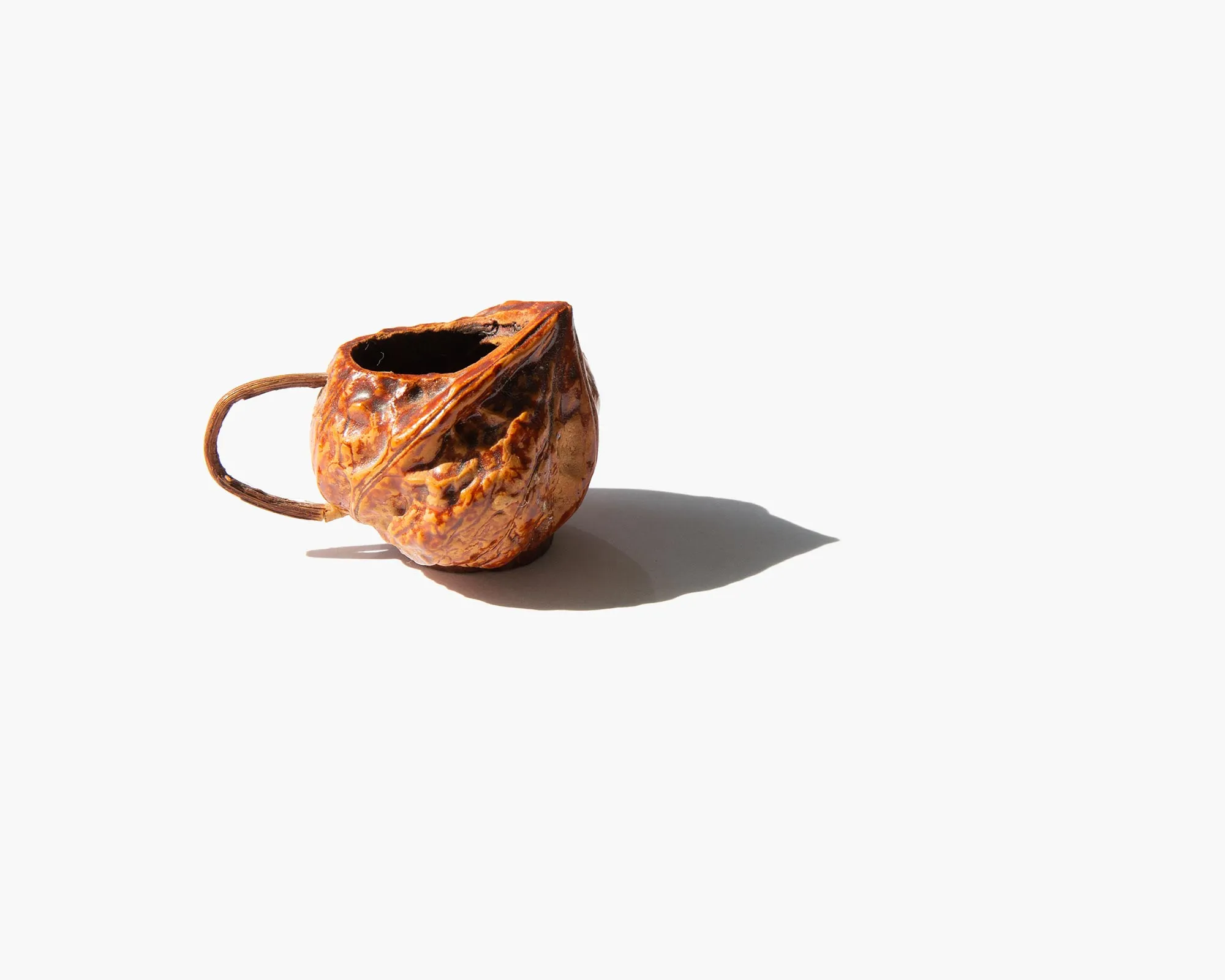 Carved Walnut Shell Pitcher