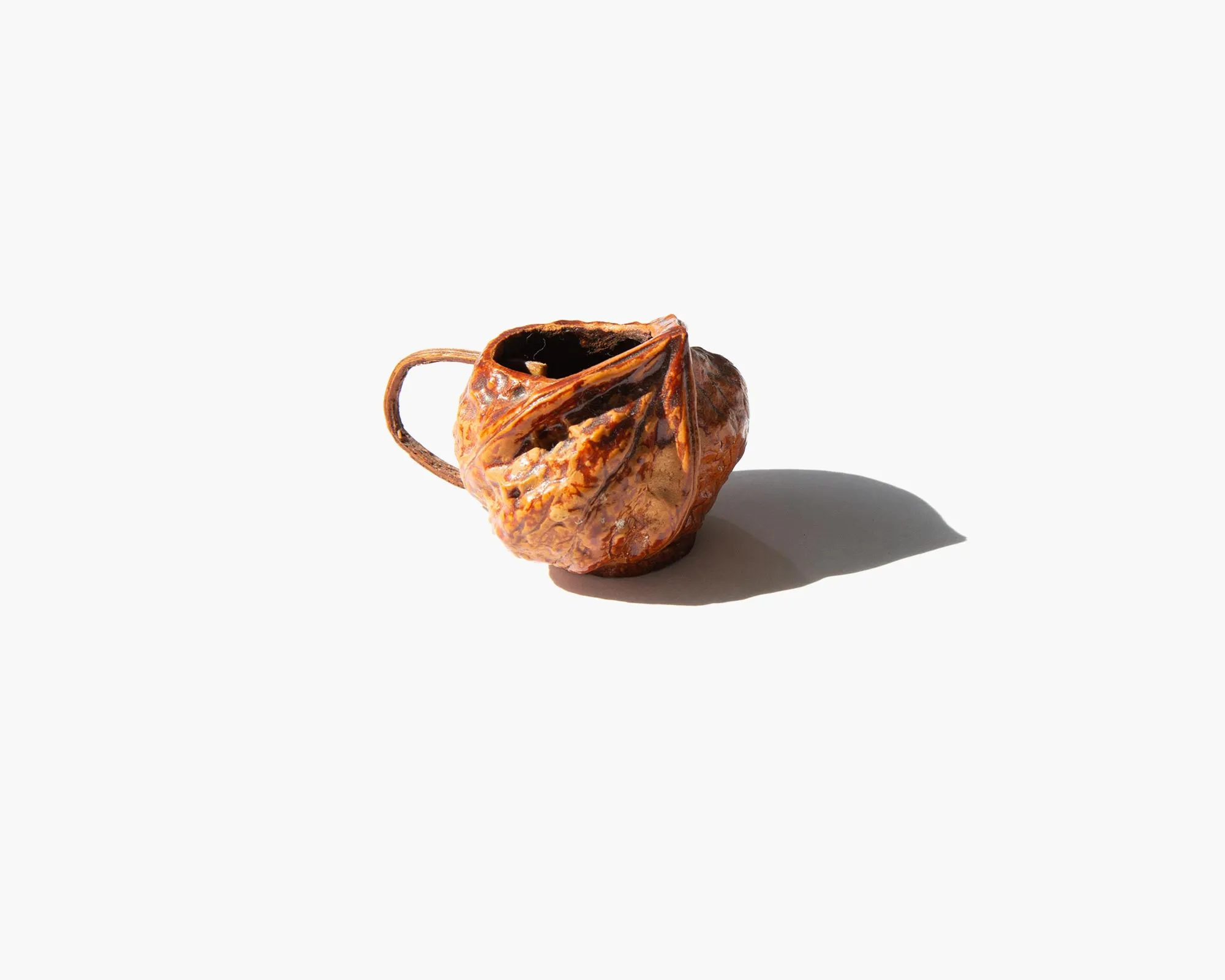 Carved Walnut Shell Pitcher