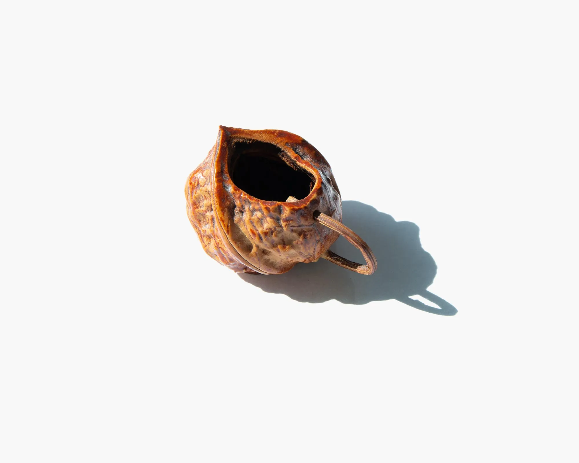 Carved Walnut Shell Pitcher
